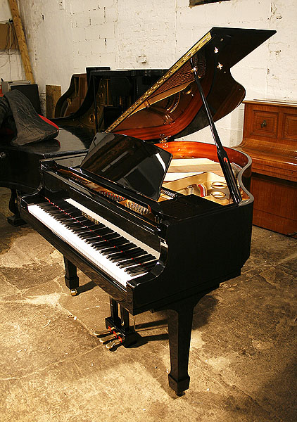 Brand new, Steinberg WS-T166 grand piano with a black case and brass fittings.Piano has an eighty-eight note keyboard and a three-pedal piano lyre.