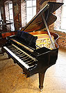 A Steinway Model S grand piano with a black case and polyester finish. A Steinway Model S grand piano with a black case and polyester finish.