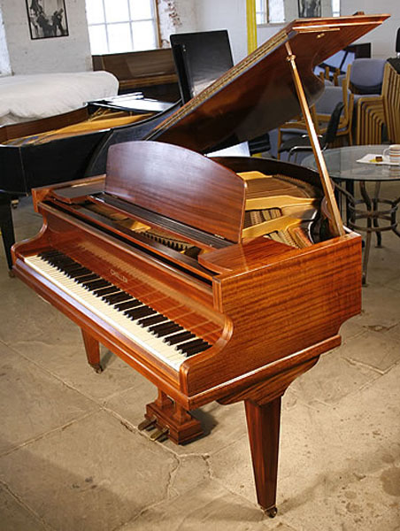 A 1936, Challen baby grand piano with a mahogany case. Previously the property of Hurricane Smith, studio engineer to the Beatles
