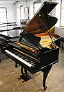 A Bechstein Model A grand piano with a polished, black case and cabriole legs A Bechstein Model A grand piano with a polished, black case and cabriole legs