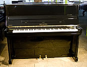 A Bechstein Studio 120 upright piano with a black case and polyester finish A Bechstein Studio 120 upright piano with a black case and polyester finish
