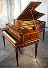 An Erard grand piano with an inlaid, mahogany case. An Erard grand piano with an inlaid, mahogany case.