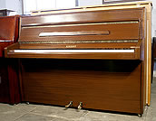 A Knight upright piano with a mahogany case A Knight upright piano with a mahogany case.