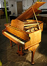 A Monington and Weston baby grand piano with a walnut case. Ideal for a smaller space. A Monington and Weston baby grand piano with a walnut case. Ideal for a smaller space.