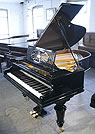 A Bechstein Model A grand piano with a polished, black case and cabriole legs A restored, Bechstein Model A grand piano with a polished, black case