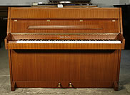 A Bentley upright piano with a mahogany case A Bentley upright piano with a mahogany case