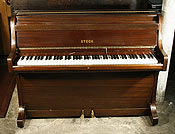 A Steck upright piano with a mahogany case A Steck upright piano with a mahogany case.