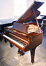 A Steinway Model S grand piano with a mahogany case A Steinway Model S grand piano with a mahogany case.