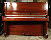 A Steinway Model V upright piano with a mahogany case A Steinway Model V upright piano with a mahogany case.
