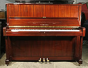 A Yamaha U1A upright piano with a mahogany case and polyester finish. A Yamaha U1A upright piano with a mahogany case and polyester finish.