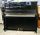 An Apollo upright piano with a black case. An Apollo upright piano with a black case.