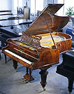 An antique Bechstein Model V grand piano with a polished, burr walnut case An antique Bechstein Model V grand piano with a polished, burr walnut case
