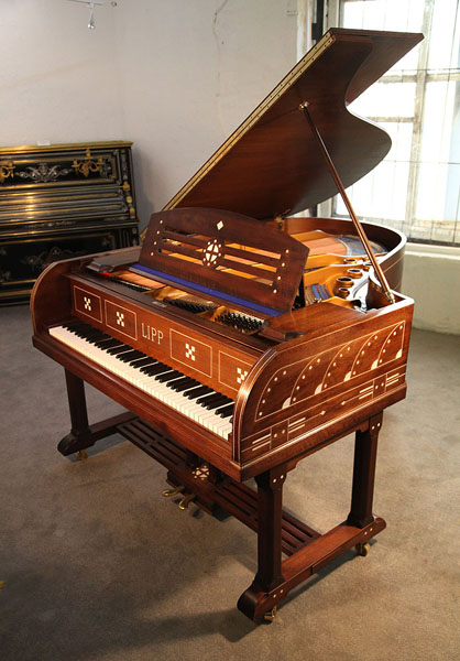 Restored, Arts and Crafts, Lipp grand piano for sale with a mahogany case inlaid with geometric designs. Case features ornate brass hinges and slatted cross stretcher