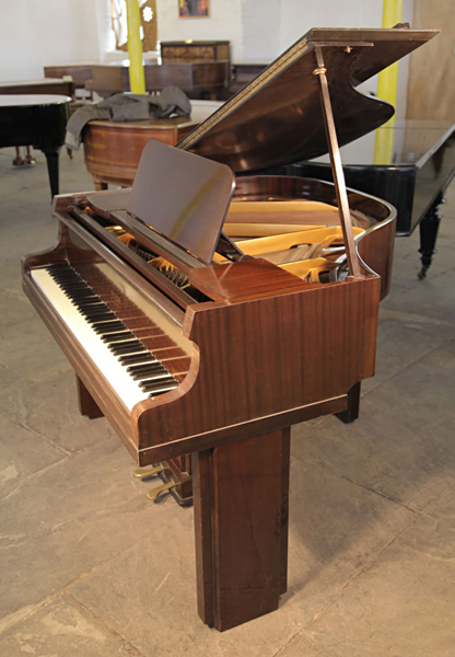 A 1939, Art Deco Allison baby grand piano with a polished mahogany case. Legs and lyre feature strong geometric styling. Piano has an eighty-five note keyboard and a two-pedal piano lyre. 