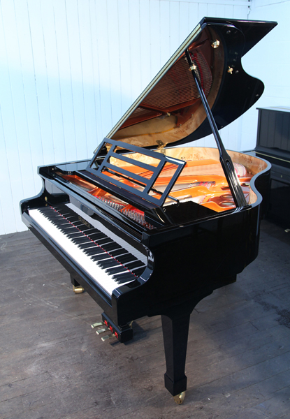 Brand new, Feurich Model 161 Professional grand piano with a black case and brass fittings.  Piano has an eighty-eight note keyboard and a three-pedal piano lyre. 