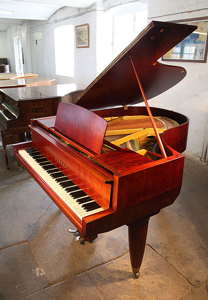A 1955, Yamaha No20 grand piano with a satin, mahogany case