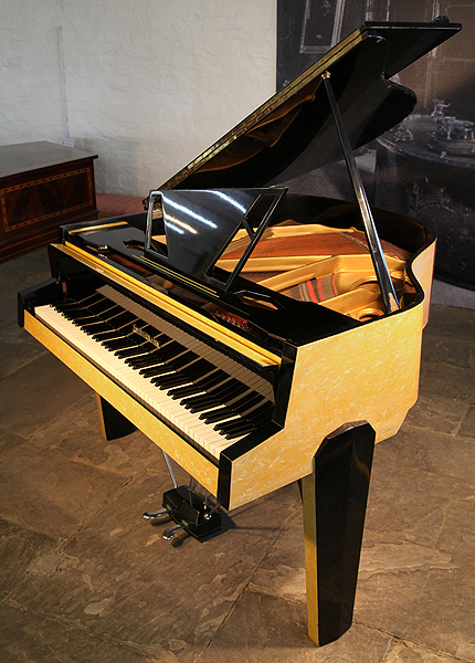 Reconditioned, 1950's Zimmermann Baby Grand Piano For Sale with a Marble Effect Yellow and Black Formica Case. Cabinet Features an Asymmetrical Music Desk with Geometric Cut-Outs, Geometric Legs and Tubular Steel Piano Lyre