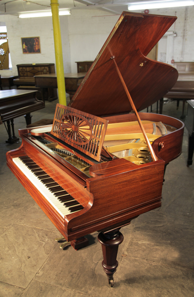 Antique, Bechstein Model A grand piano with a polished, rosewood case and turned legs. Piano has an eighty-five note keyboard and a two-pedal piano lyre. 