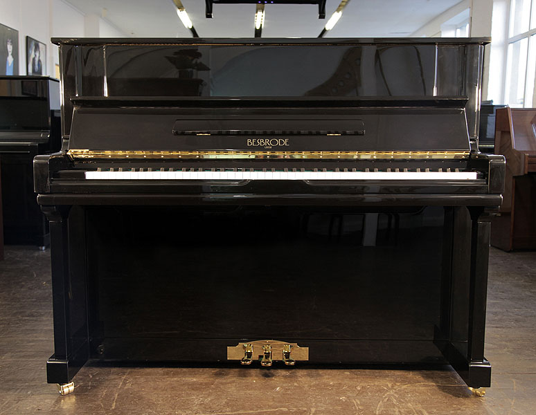 Brand new, Besbrode 122 upright piano with a black case.