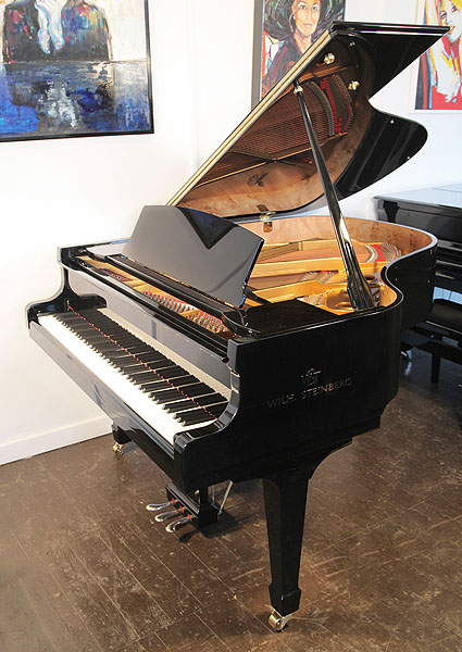 Brand new, Steinberg WS-T166 grand piano with a black case and brass fittings.  Piano has an eighty-eight note keyboard and three-pedal lyre.
