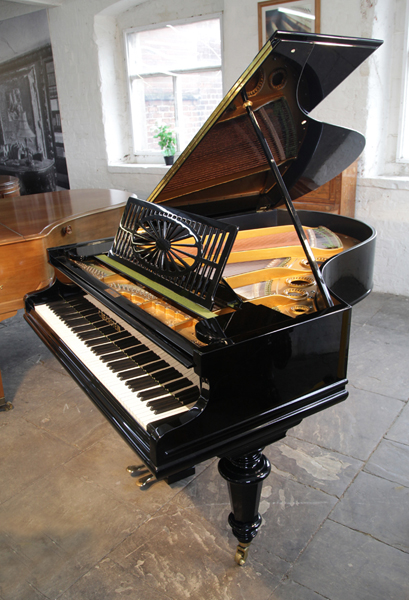 A 1939, Art Deco Allison baby grand piano with a polished satinwood case. Legs and lyre feature strong geometric styling
