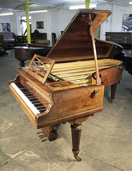 An 1854, Erard No 2 Grand Piano For Sale with a Walnut Case and Brass Stringing Inlay. Piano has an openwork music desk, traditional, lyre shaped piano lyre and faceted legs