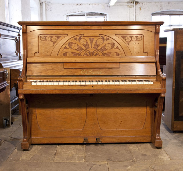 A 1903, Seiler upright piano for sale with an Art Nouveau style walnut case. Cabinet features a front panel carved with stylised poppies. 