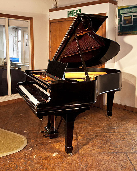 A rebuilt, 1911, Steinway Model O grand piano for sale with a black case and spade legs. Piano has an eighty-eight note keyboard and a two-pedal lyre 