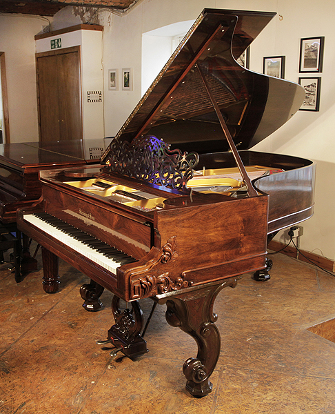 A rebuilt, 1877, Steinway Style 1 grand piano for sale with a rosewood case and carved, cabriole legs