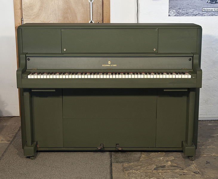 A 1945, Steinway 'Victory Vertical' G.I. upright piano for sale with an olive drab case. This upright was airdropped onto battlefields during WWII for the American troops. Piano has an eighty-eight note keyboard and three pedals. 
