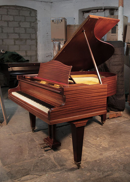 A 1935, Bechstein Model L grand piano with a polished, mahogany case and square, tapered legs