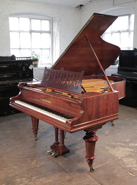 Restored, 1895, Bechstein Model VA grand piano for sale with a rosewood case, cut-out music desk and turned, faceted legs.  Piano has an eighty-eight note keyboard and a two-pedal lyre. 