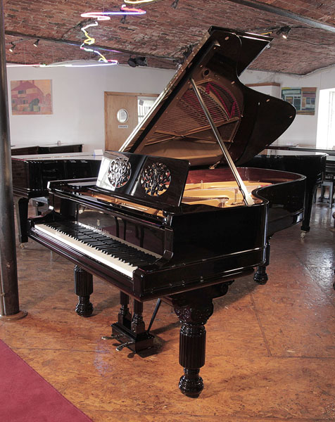 Restored, 1881, Steinway Model B grand piano with a gloss, black case and brass fittings. Piano has an eighty-five  note keyboard and a two-pedal  lyre