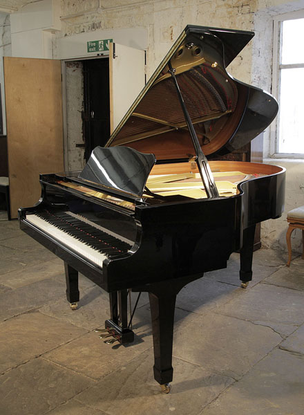 A 1993, Yamaha G3 grand piano for sale with a black case and spade legs. Piano has an eighty-eight note keyboard and a three-pedal lyre.