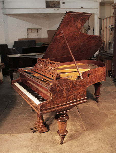 An 1898, Bechstein model V grand piano for sale with a burr walnut case and turned, faceted legs.  Piano has an eighty-eight note keyboard and a two-pedal lyre. 