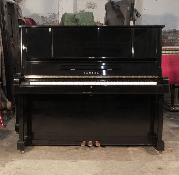 Reconditioned, 1982, Yamaha YUX upright piano for sale with a  black case and brass fittings. Piano has an eighty-eight note keyboard and three pedals. 
 