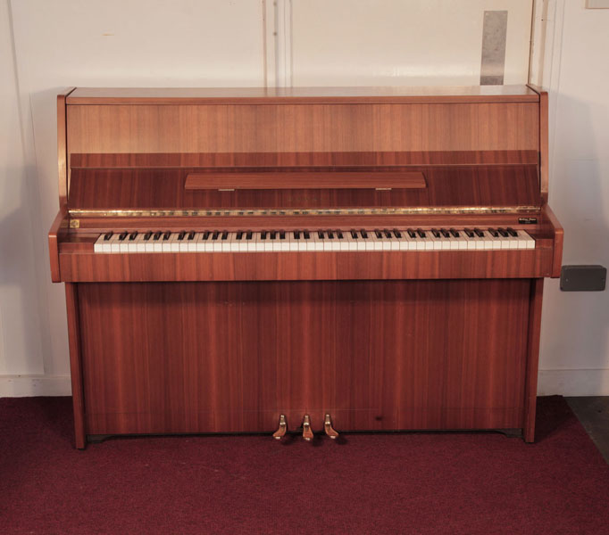 A 1981, Kawai CE-7N Upright Piano For Sale with a Satin, Walnut Case and Brass Fittings. Piano has an eighty-eight note keyboard and three pedals. 