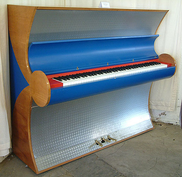 Art cased, Besbrode upright piano specially commissioned for the Frankfurt Fair 2000. Piano uniquely finished with aluminium and leather. Piano has an eighty-eight note keyboard and three pedals