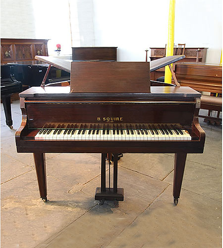 A 1939, Squire butterfly baby grand piano with a mahogany case