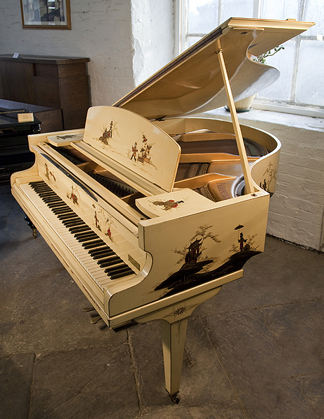 A D'Almaine grand piano with a cream case, covered with Japanese paintings