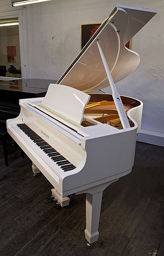 Brand new, Steinhoven Model 148 baby grand piano with a white case and polyester finish. Piano has an eighty-eight note keyboard and a three-pedal piano lyre.
