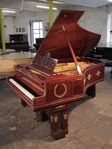 Empire style, 1901, Ibach model 2 grand piano for sale with a mahogany case and gate legs. Entire cabinet decorated with ormolu mounts depicting scenes of greek gods, goddesses and wreaths. Piano has an eighty-eight note keyboard and a two-pedal lyre.