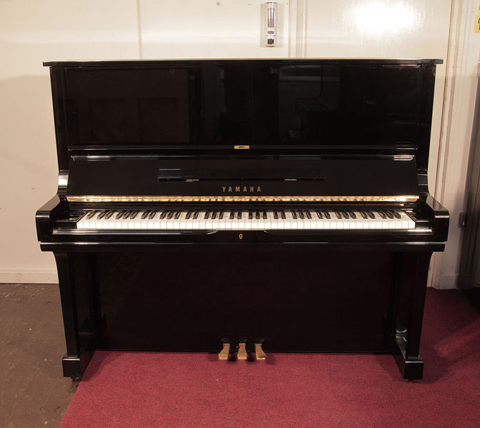 Reconditioned, 1984, Yamaha U3 upright piano for sale with a black case and brass fittings. Piano has an eighty-eight note keyboard and three pedals.  