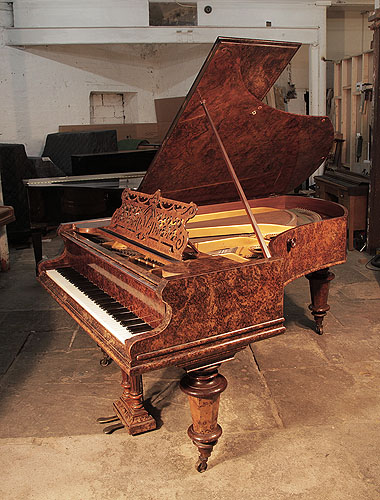 An 1898, Bechstein model V grand piano for sale with a burr walnut case and turned, faceted legs.