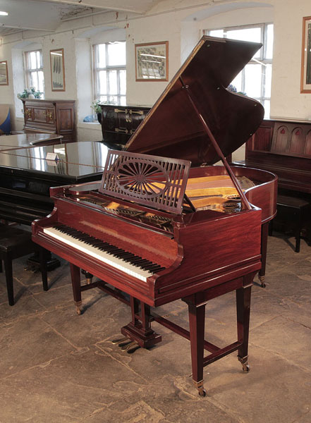 A 1925,  Bechstein Model A grand piano with a rosewood, cut-out music desk and gate legs. Piano has an eighty-five note keyboard and a two-pedal lyre. 