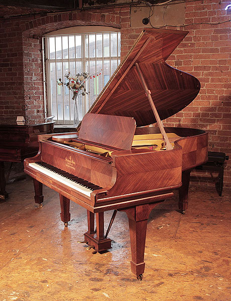 A 1905, Steinway Model A grand piano for sale with a quartered, kingswood case and spade legs. Piano has an eighty-eight note keyboard and a two-pedal lyre.