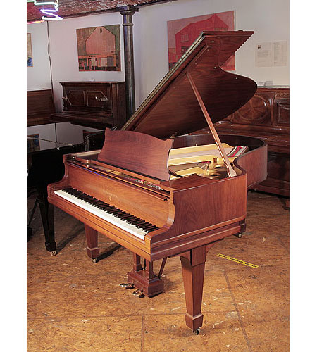 Rebuilt, 1925, Steinway Model O grand piano for sale with a polished, walnut case and spade legs. Piano has an eighty-eight note keyboard and a two-pedal lyre. 