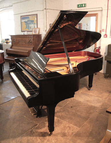 Reconditioned, 1975, Steinway Model B Steinway Model B grand piano for sale with a black case and spade legs. Piano has a three-pedal lyre and an eighty-eight note keyboard.