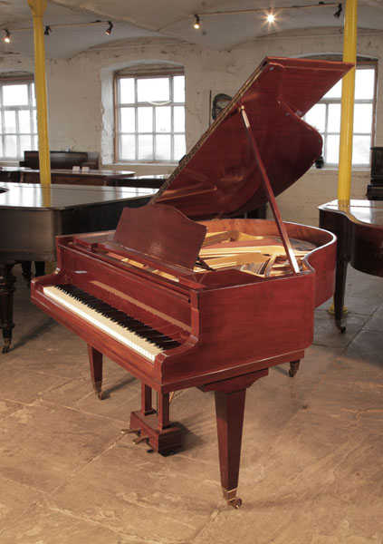 A 1932, Bluthner baby grand piano for sale with a mahogany case and square, tapered legs. Piano has an eighty-eight note keyboard and a two-pedal lyre. 