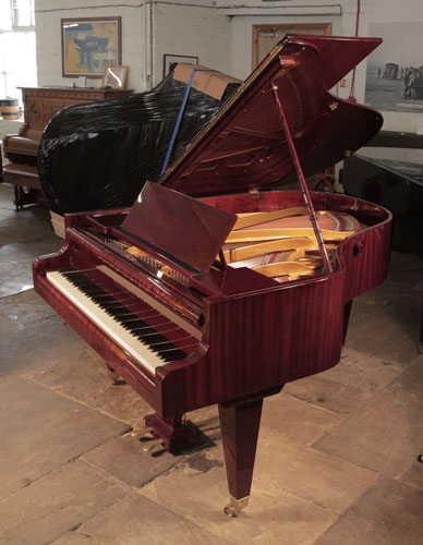 Restored, 1930's Bosendorfer grand piano for sale with a mahogany case and square, tapered legs. Piano has an eighty-eight note keyboard and a two-pedal lyre.